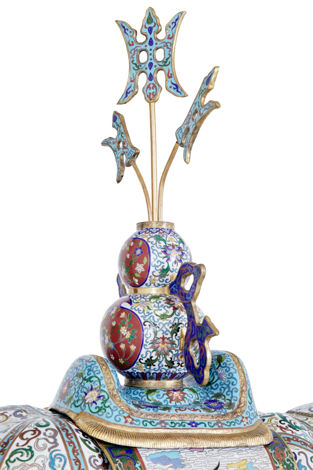 An ornate Chinese cloisonne enamel elephant sculpture with a decorated saddle blanket, standing atop a matching enamel pedestal base. View X