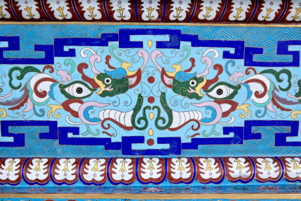 An ornate Chinese cloisonne enamel elephant sculpture with a decorated saddle blanket, standing atop a matching enamel pedestal base. View XIV