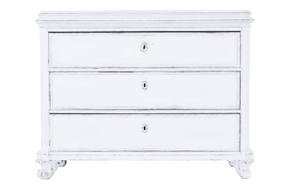 A 19th-century Swedish chest of drawers featuring three long drawers with central escutcheons and a distressed white painted finish resting on carved feet. View II