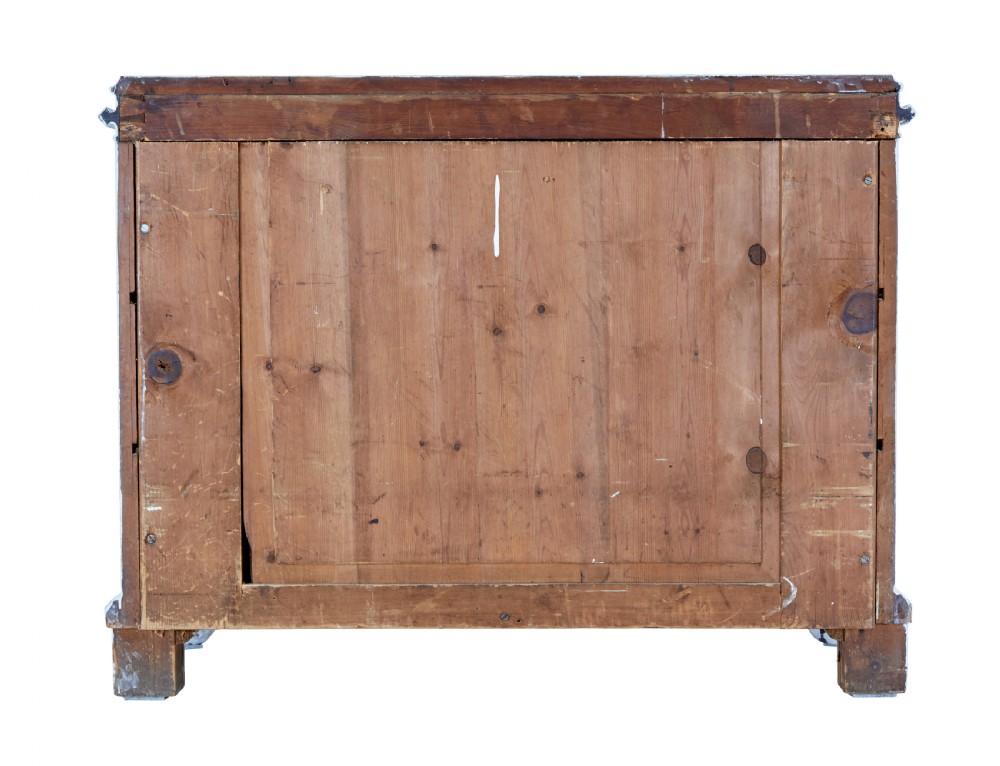 A 19th-century Swedish chest of drawers featuring three long drawers with central escutcheons and a distressed white painted finish resting on carved feet. View VI