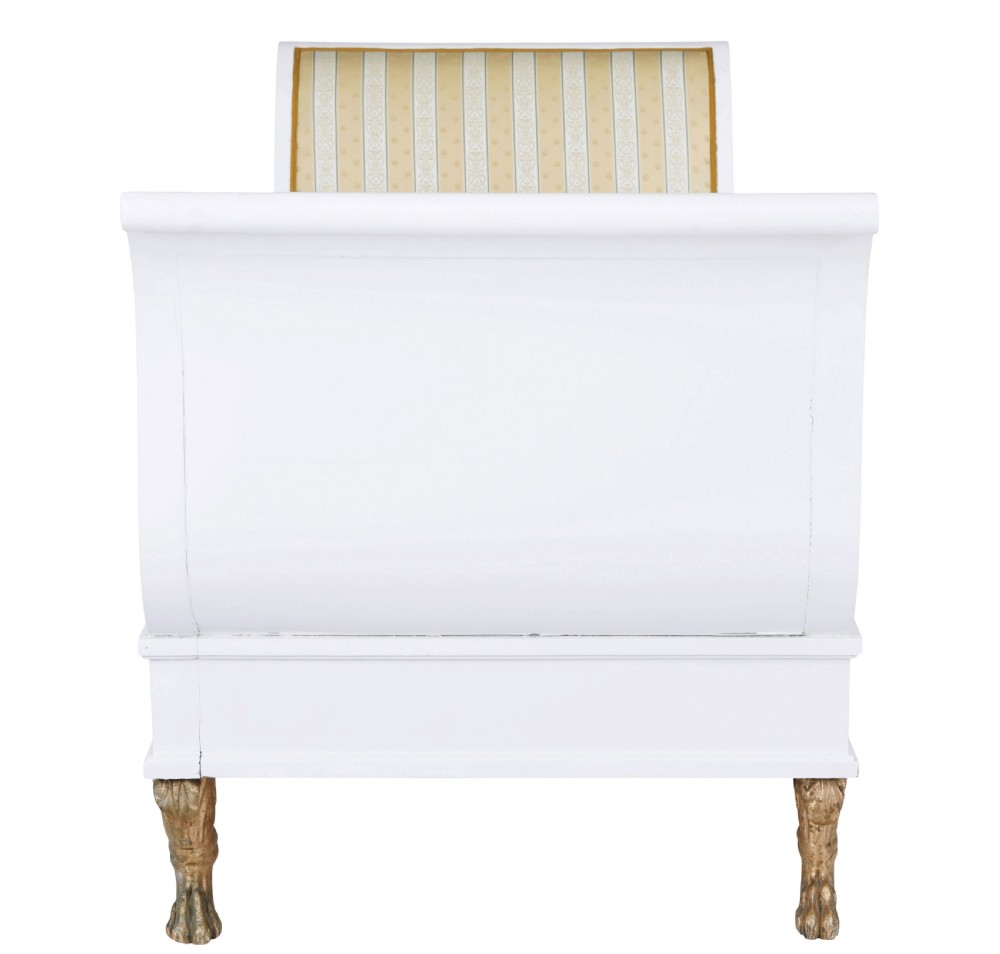 An early 20th-century Scandinavian Empire Revival day bed featuring a white painted frame, flared scroll ends, carved gilded paw feet, and yellow striped fabric upholstery. View III