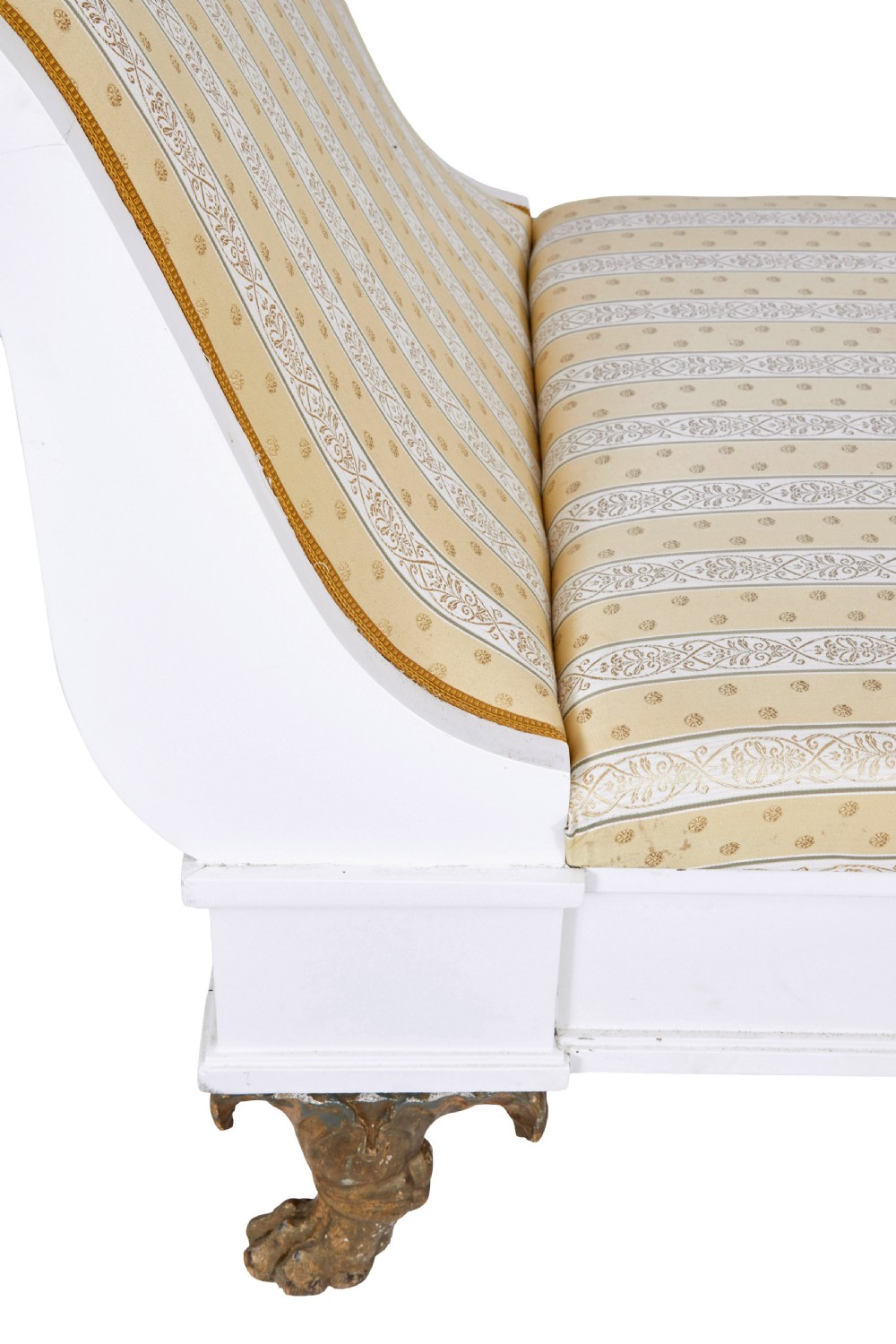 An early 20th-century Scandinavian Empire Revival day bed featuring a white painted frame, flared scroll ends, carved gilded paw feet, and yellow striped fabric upholstery. View V