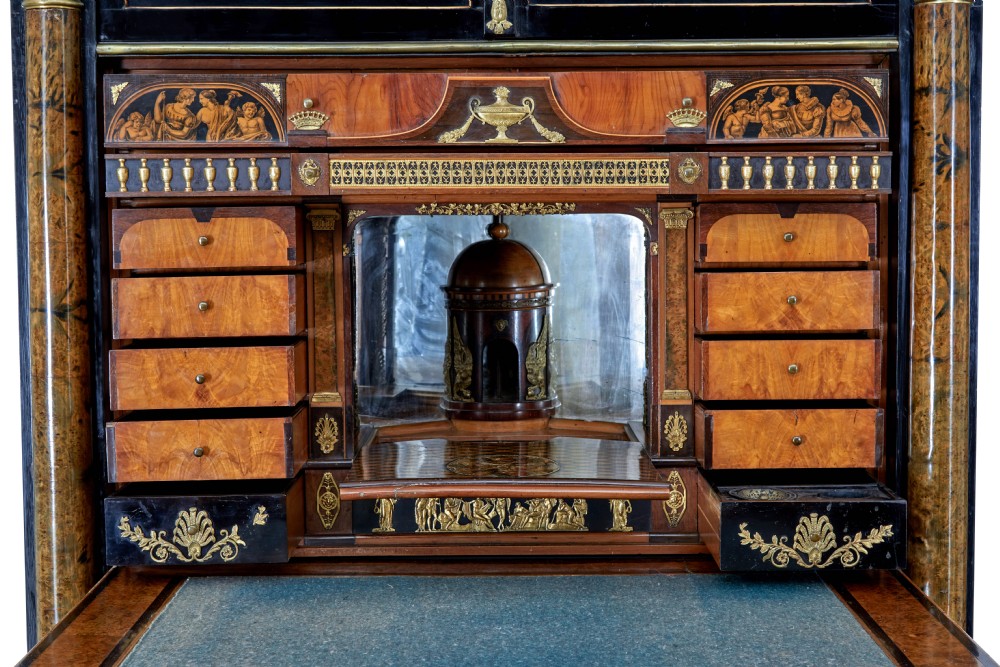 An early 19th-century ebonised birch Biedermeier escritoire featuring gilded bronze mounts, architectural side columns, and multiple cabinet doors. View XII