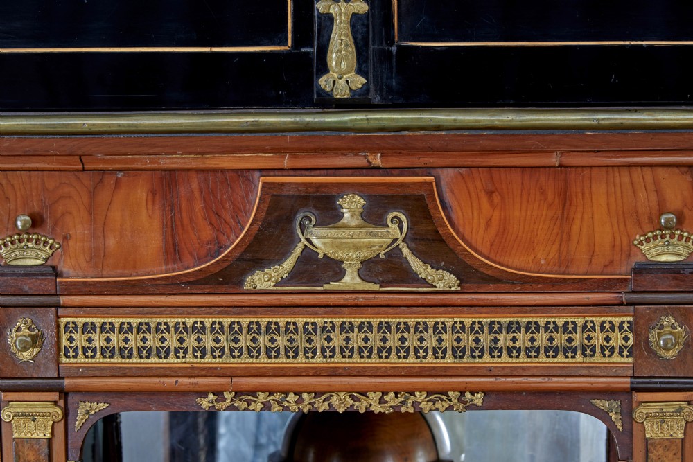 An early 19th-century ebonised birch Biedermeier escritoire featuring gilded bronze mounts, architectural side columns, and multiple cabinet doors. View XIV