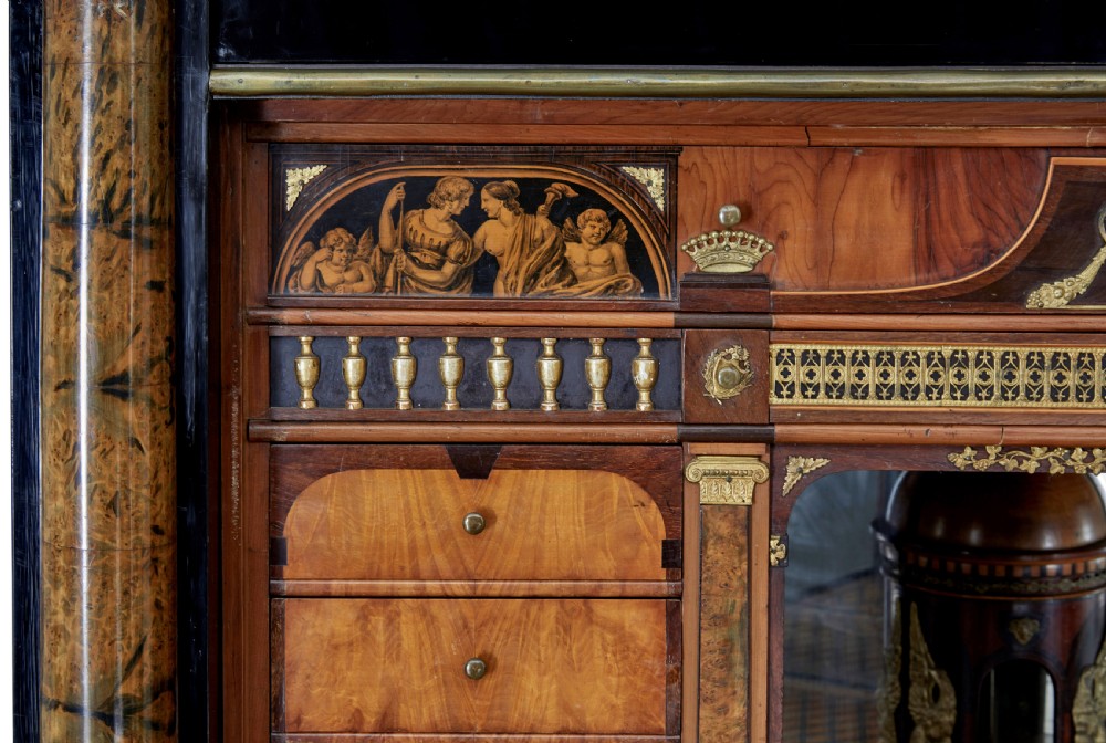 An early 19th-century ebonised birch Biedermeier escritoire featuring gilded bronze mounts, architectural side columns, and multiple cabinet doors. View XVI