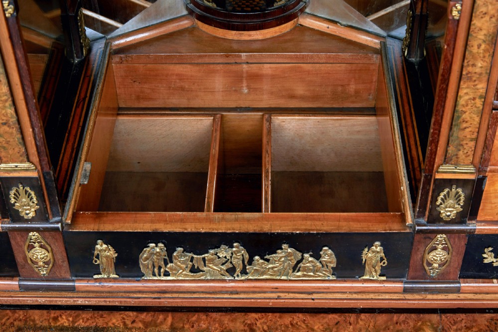 An early 19th-century ebonised birch Biedermeier escritoire featuring gilded bronze mounts, architectural side columns, and multiple cabinet doors. View XVIII