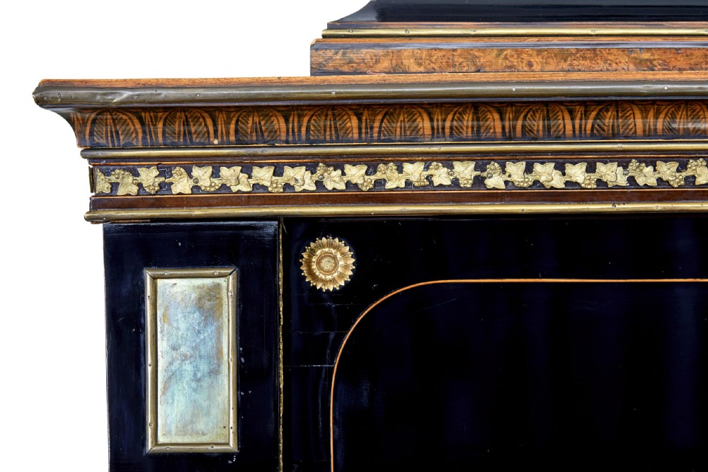 An early 19th-century ebonised birch Biedermeier escritoire featuring gilded bronze mounts, architectural side columns, and multiple cabinet doors. View XIX