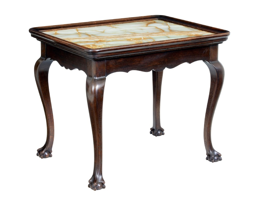 A 19th-century dark oak rectangular side table featuring a polished green and beige onyx top, carved cabriole legs, and ball-and-claw feet.