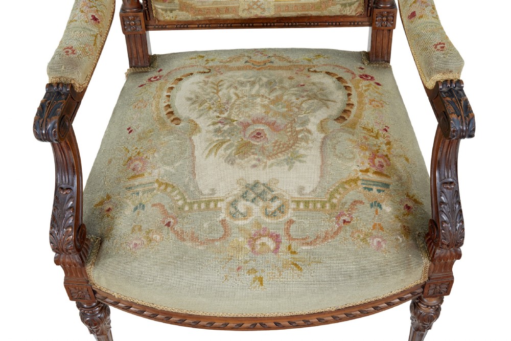 A pair of 19th-century French carved walnut armchairs upholstered in woven tapestry fabric featuring pastoral scenes and fluted turned legs. View VII