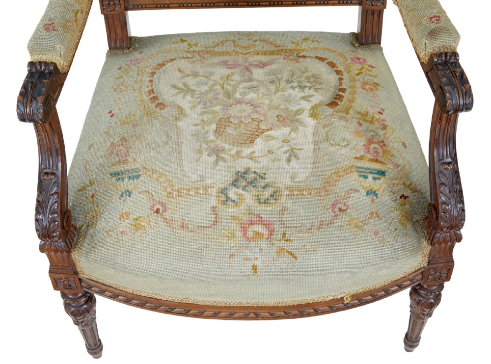 A pair of 19th-century French carved walnut armchairs upholstered in woven tapestry fabric featuring pastoral scenes and fluted turned legs. View VIII