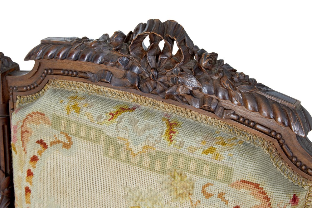 A pair of 19th-century French carved walnut armchairs upholstered in woven tapestry fabric featuring pastoral scenes and fluted turned legs. View IX