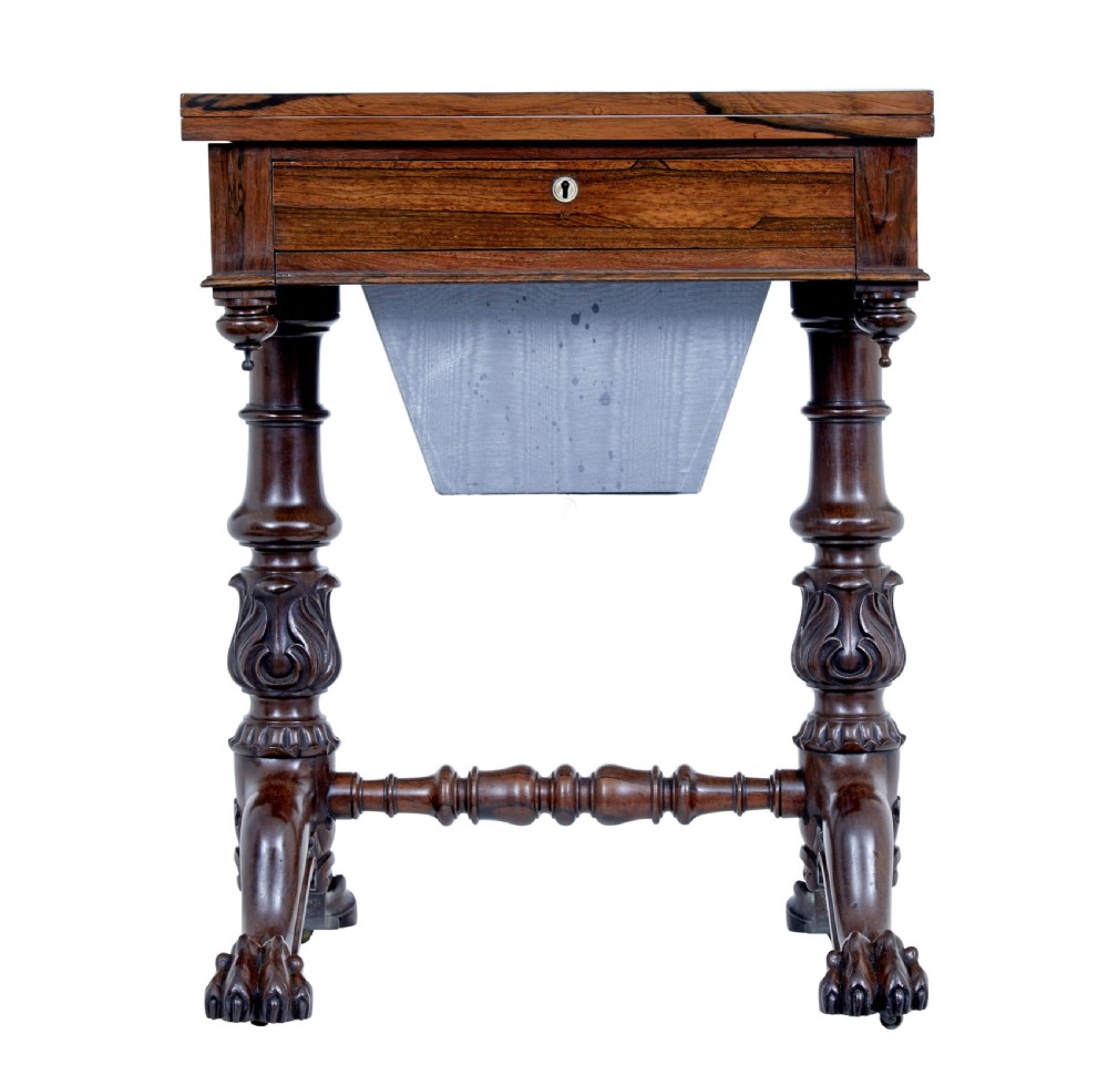 A 19th-century William IV palisander flip-top side table featuring carved legs, claw feet, a single drawer, and a suspended work well beneath. View II