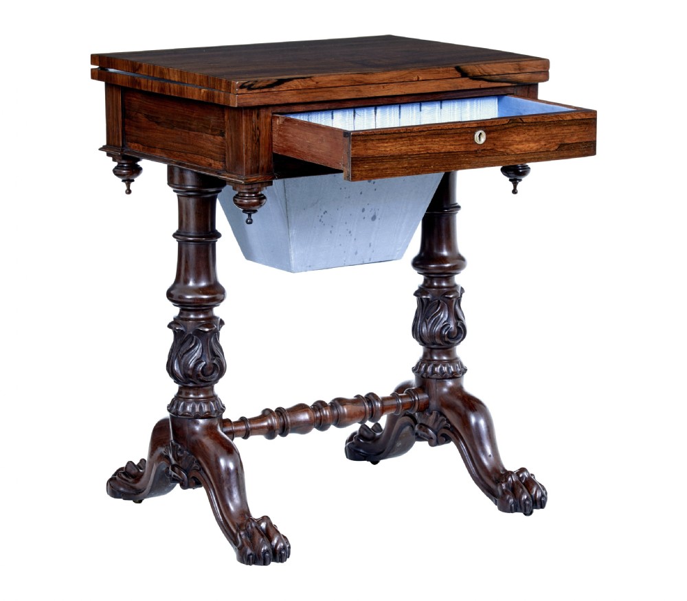 A 19th-century William IV palisander flip-top side table featuring carved legs, claw feet, a single drawer, and a suspended work well beneath. View IV