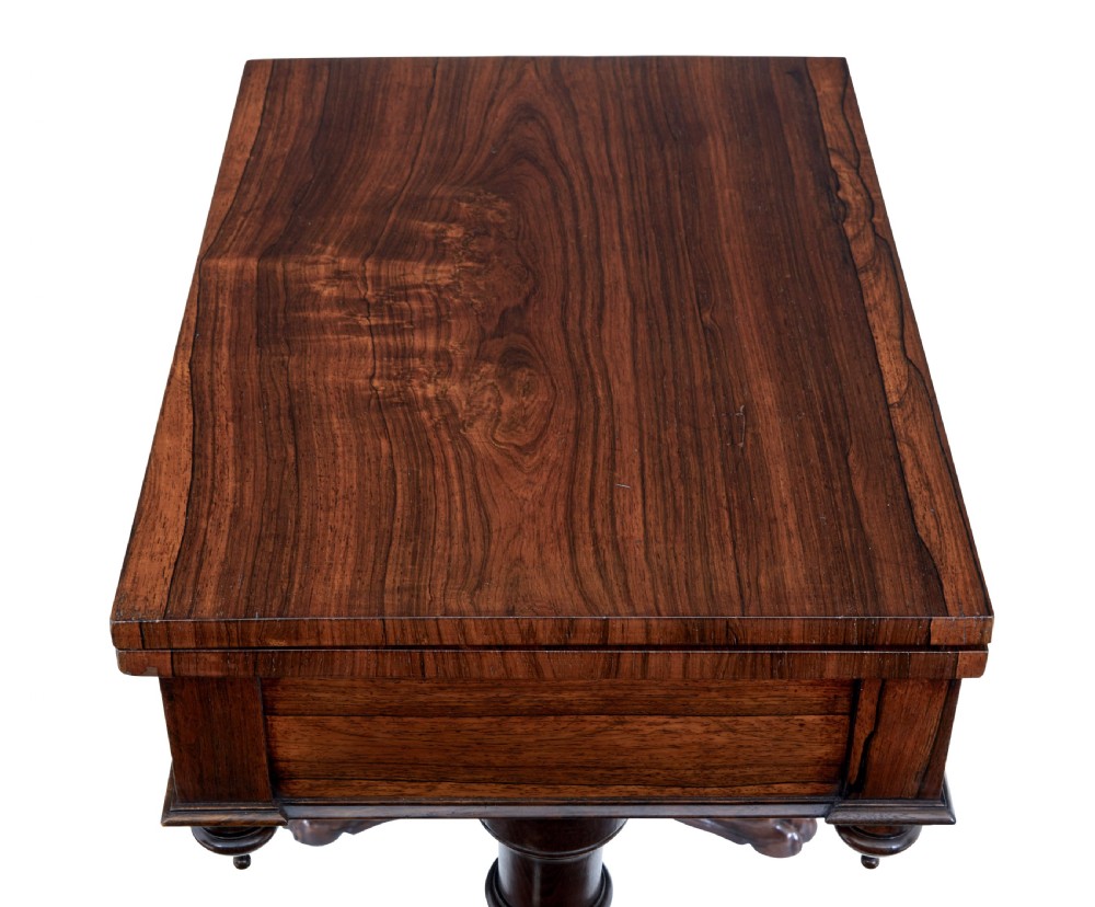 A 19th-century William IV palisander flip-top side table featuring carved legs, claw feet, a single drawer, and a suspended work well beneath. View VI