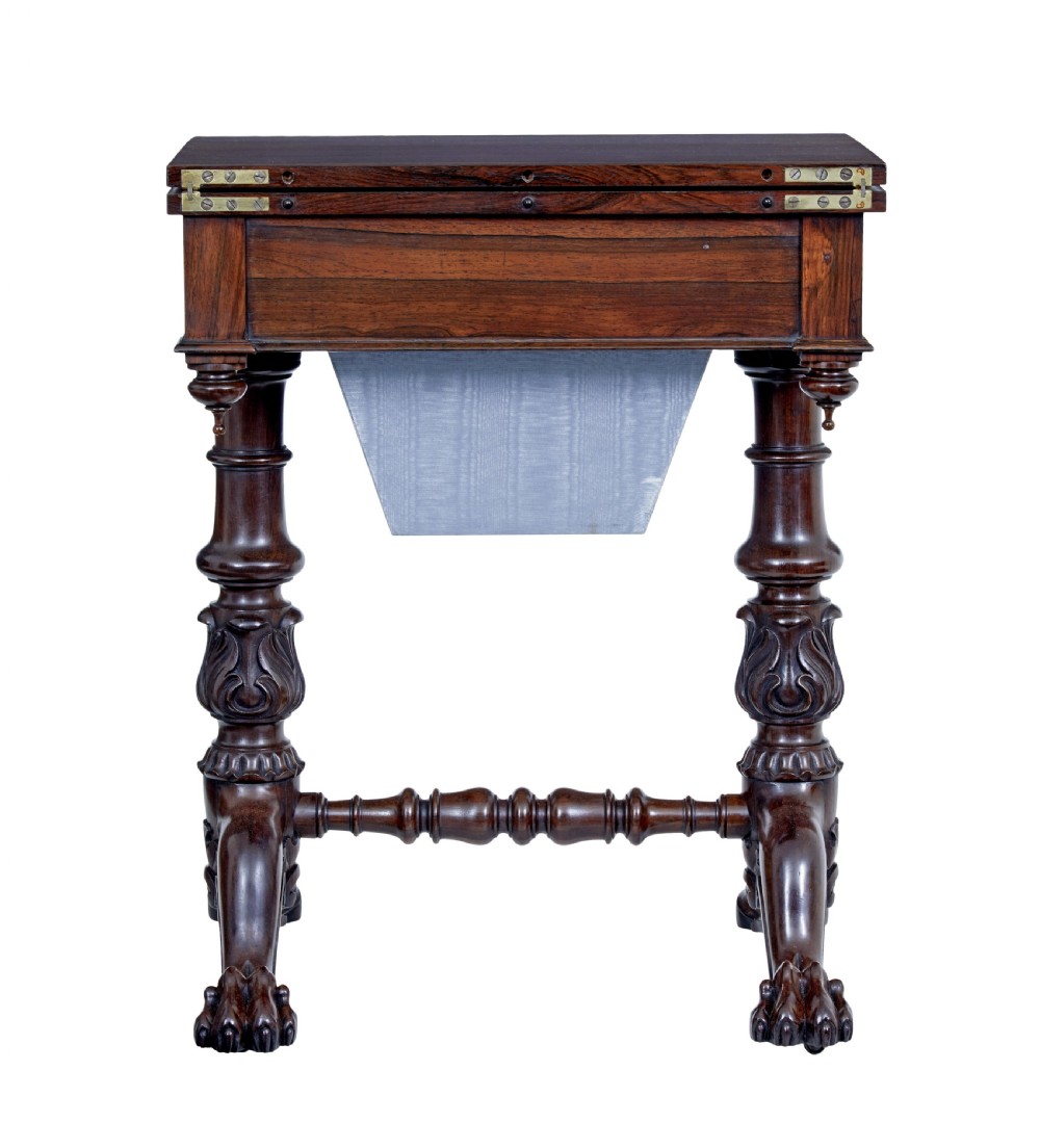A 19th-century William IV palisander flip-top side table featuring carved legs, claw feet, a single drawer, and a suspended work well beneath. View VII