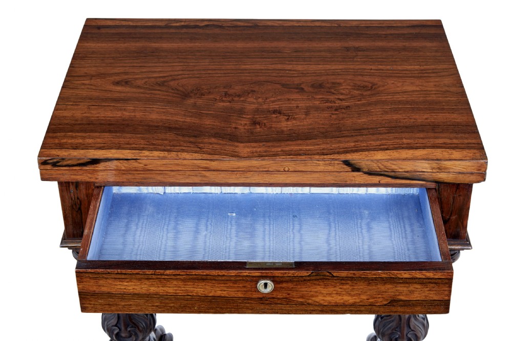 A 19th-century William IV palisander flip-top side table featuring carved legs, claw feet, a single drawer, and a suspended work well beneath. View IX