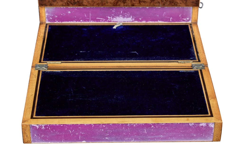 A nineteenth-century Victorian burr walnut writing slope featuring geometric inlaid border banding and a central oval cartouche. View VII