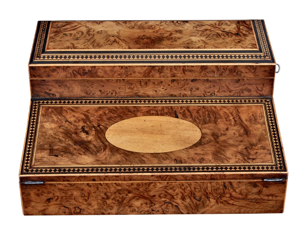 A nineteenth-century Victorian burr walnut writing slope featuring geometric inlaid border banding and a central oval cartouche. View IX