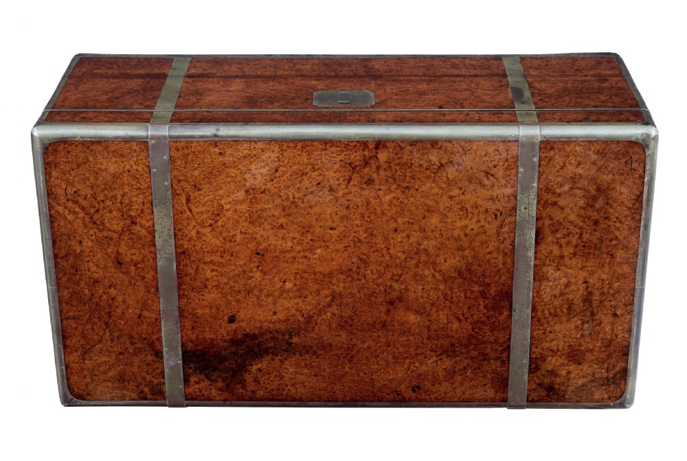 A closed mid-19th-century burr walnut campaign lap writing desk with flush brass corner brackets and brass strapping. View VIII