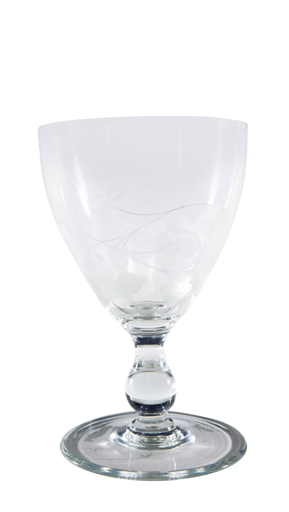 A nine-piece collection of clear 1930s glass stemware and tumblers with etched vine patterns arranged in a line. View IV