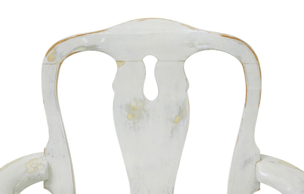 A set of fourteen distressed off-white lacquered Queen Anne style dining chairs featuring vasiform splats, cabriole legs, and striped textile upholstery. View IX