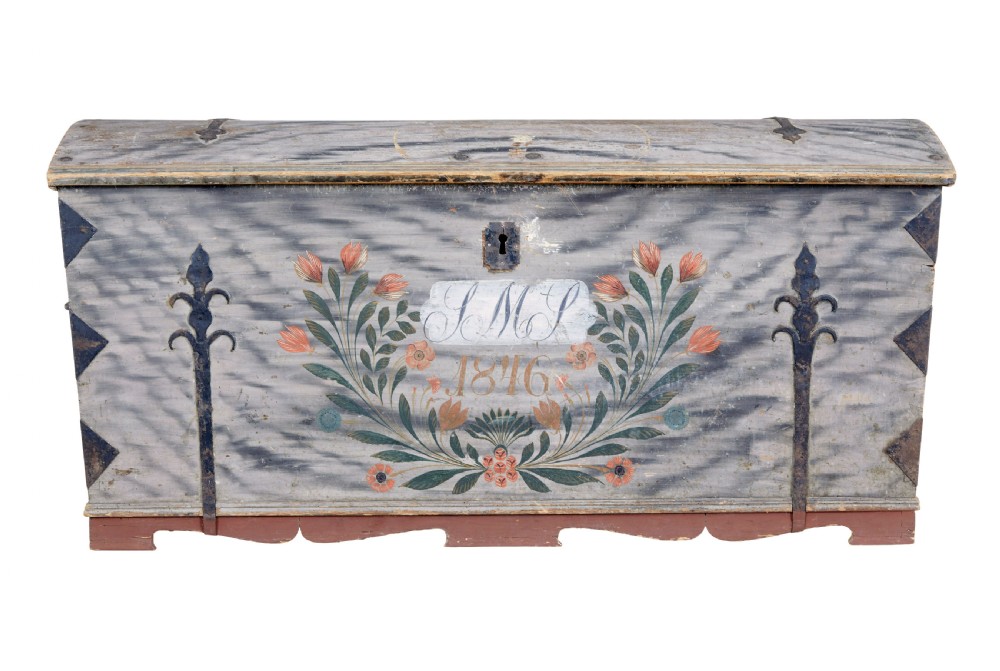 A mid-19th-century Swedish painted dome-top wooden chest featuring blue-grey grain painting, floral motifs, hand-wrought iron corner straps, and the date 1846.