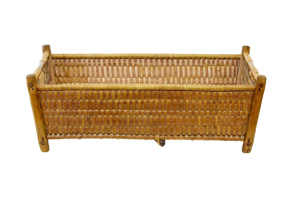 A rectangular nineteenth-century Scandinavian basket constructed from woven pine splints with raised wooden corner supports. View II