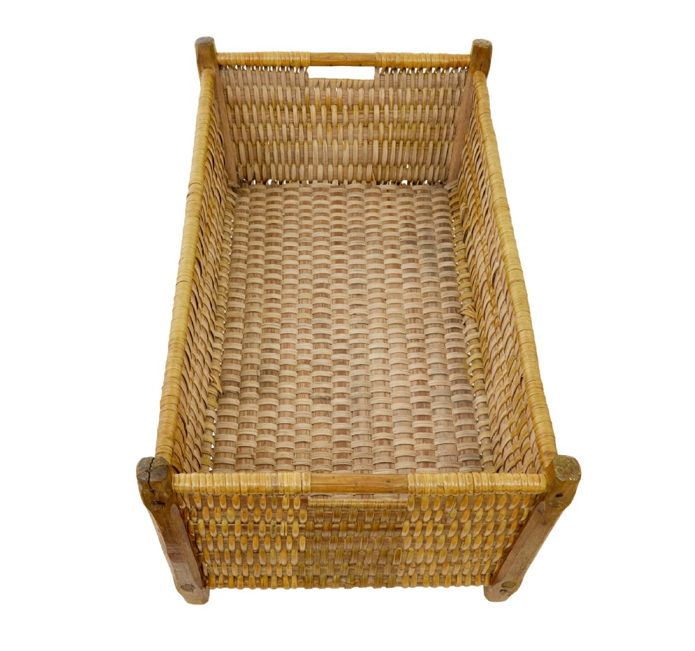 A rectangular nineteenth-century Scandinavian basket constructed from woven pine splints with raised wooden corner supports. View VI