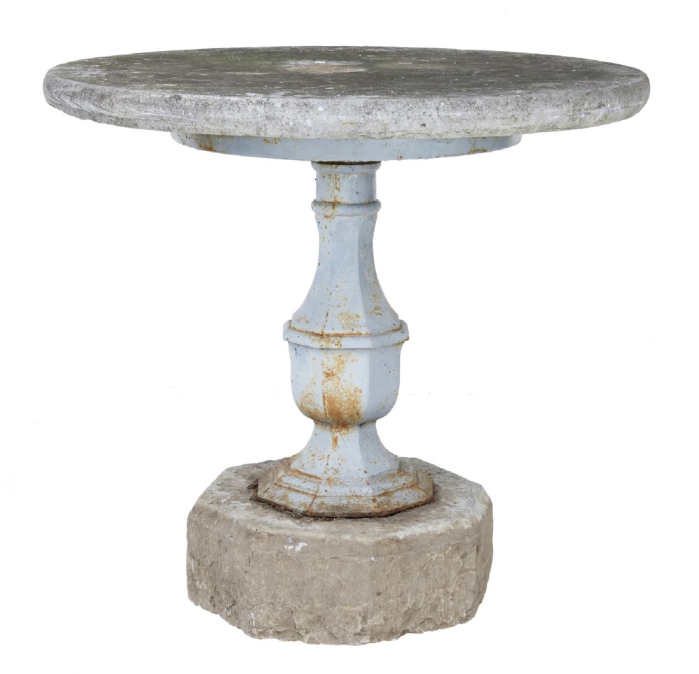 A 19th-century Swedish garden table featuring a circular stone top above a light blue painted cast iron baluster pedestal set into a heavy stone base. View II