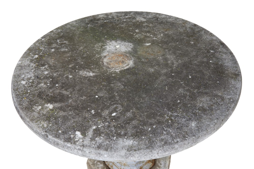 A 19th-century Swedish garden table featuring a circular stone top above a light blue painted cast iron baluster pedestal set into a heavy stone base. View III