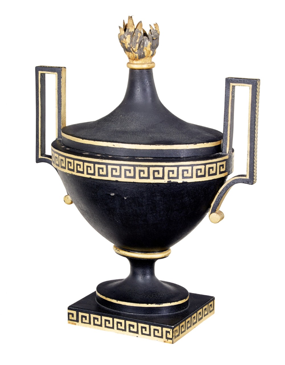 An early 19th-century black painted metal toleware urn with gilded Greek key decoration, angular handles, and a flame finial on a square plinth. View II