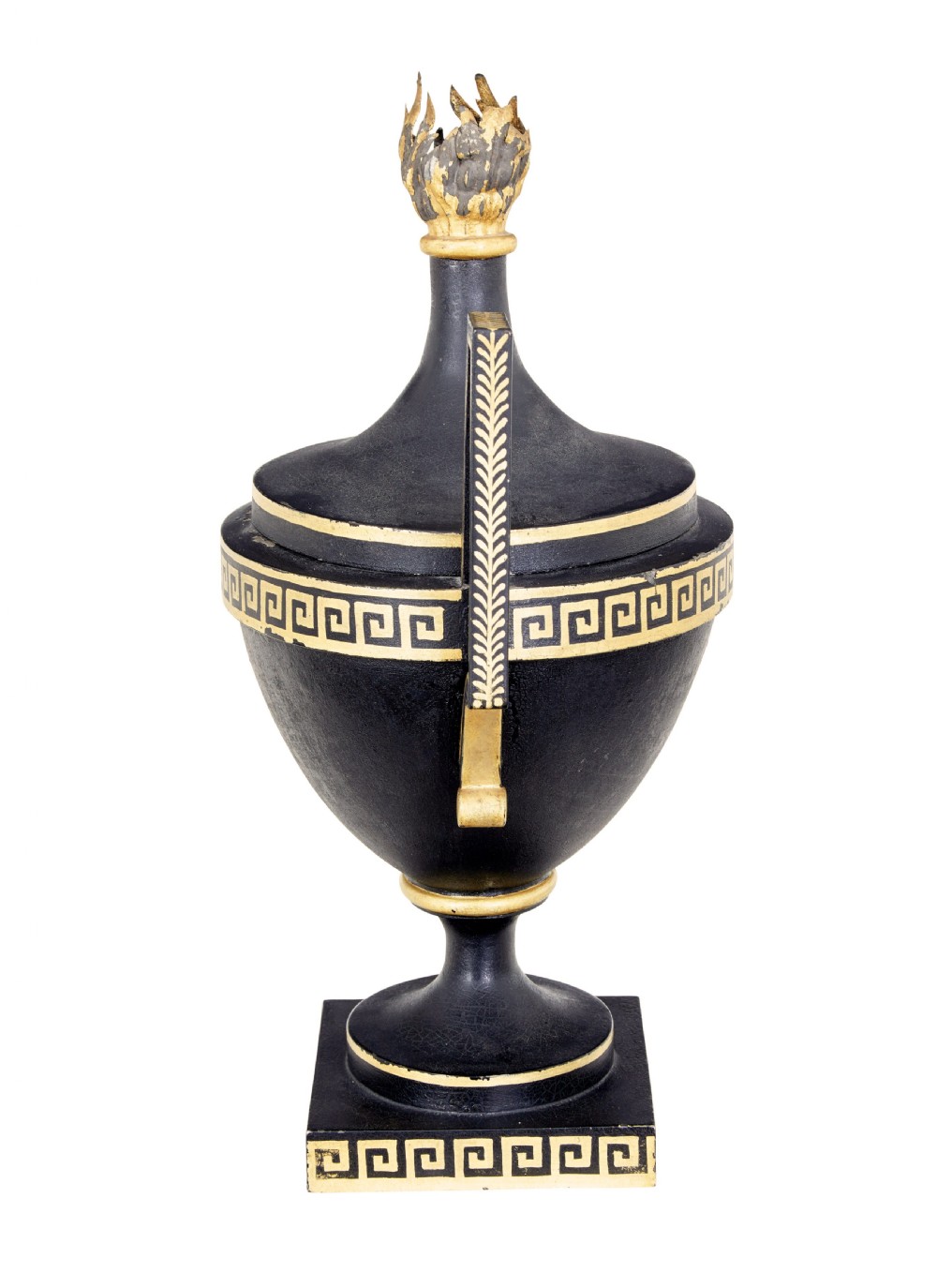 An early 19th-century black painted metal toleware urn with gilded Greek key decoration, angular handles, and a flame finial on a square plinth. View III