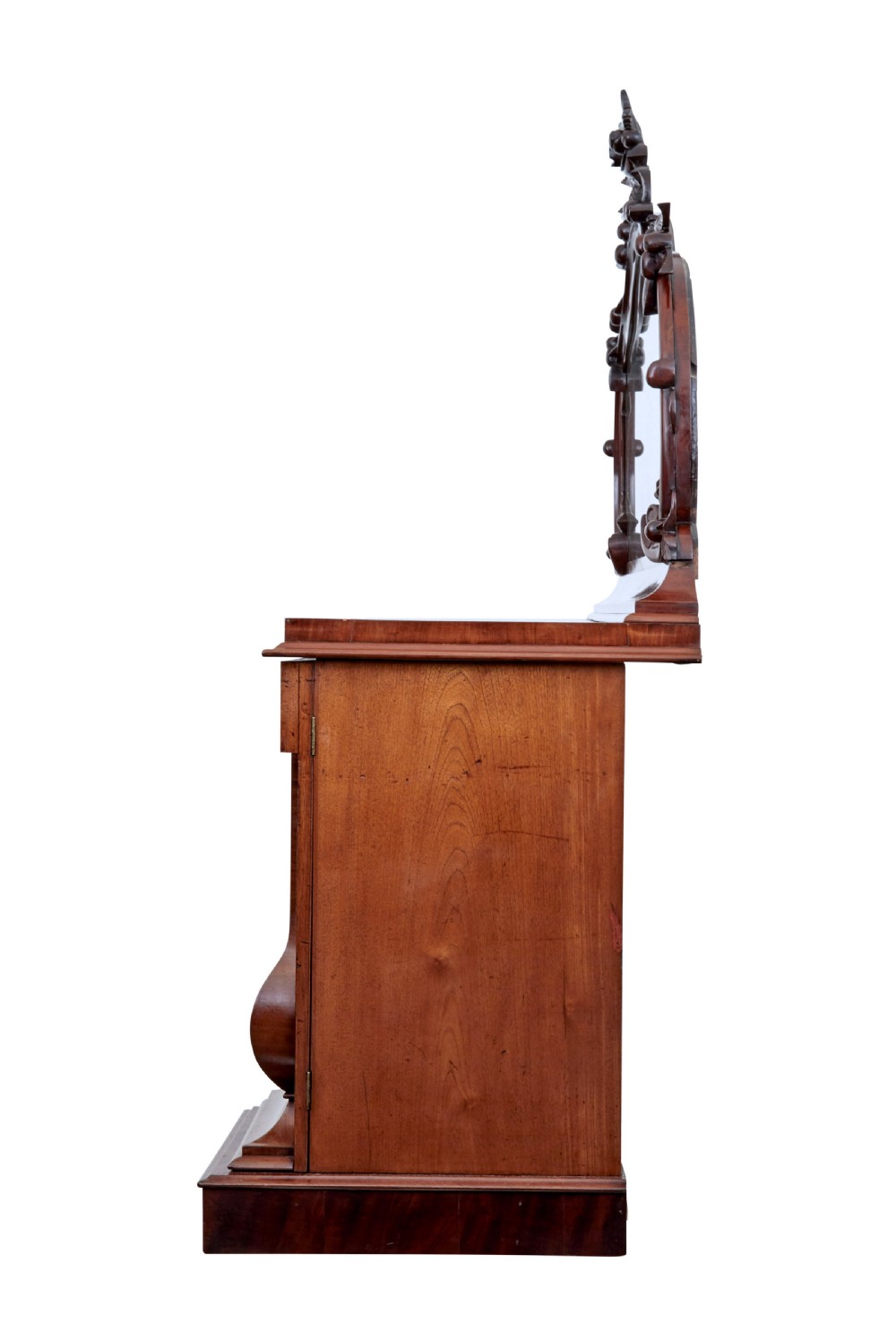 A Victorian flame mahogany sideboard featuring a carved botanical frame around an oval mirror top above cupboard doors and pedestal bases. View VIII