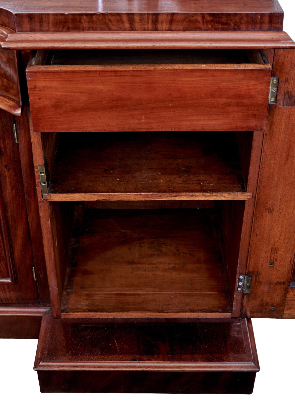 A Victorian flame mahogany sideboard featuring a carved botanical frame around an oval mirror top above cupboard doors and pedestal bases. View X