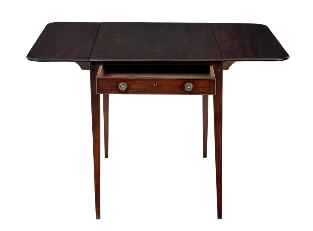 An early 19th-century mahogany Pembroke table featuring two drop-leaf flaps, a single end drawer with circular brass pull handles, and square tapered legs. View IV