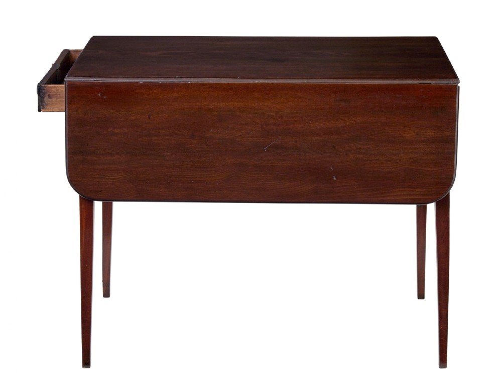 An early 19th-century mahogany Pembroke table featuring two drop-leaf flaps, a single end drawer with circular brass pull handles, and square tapered legs. View VI