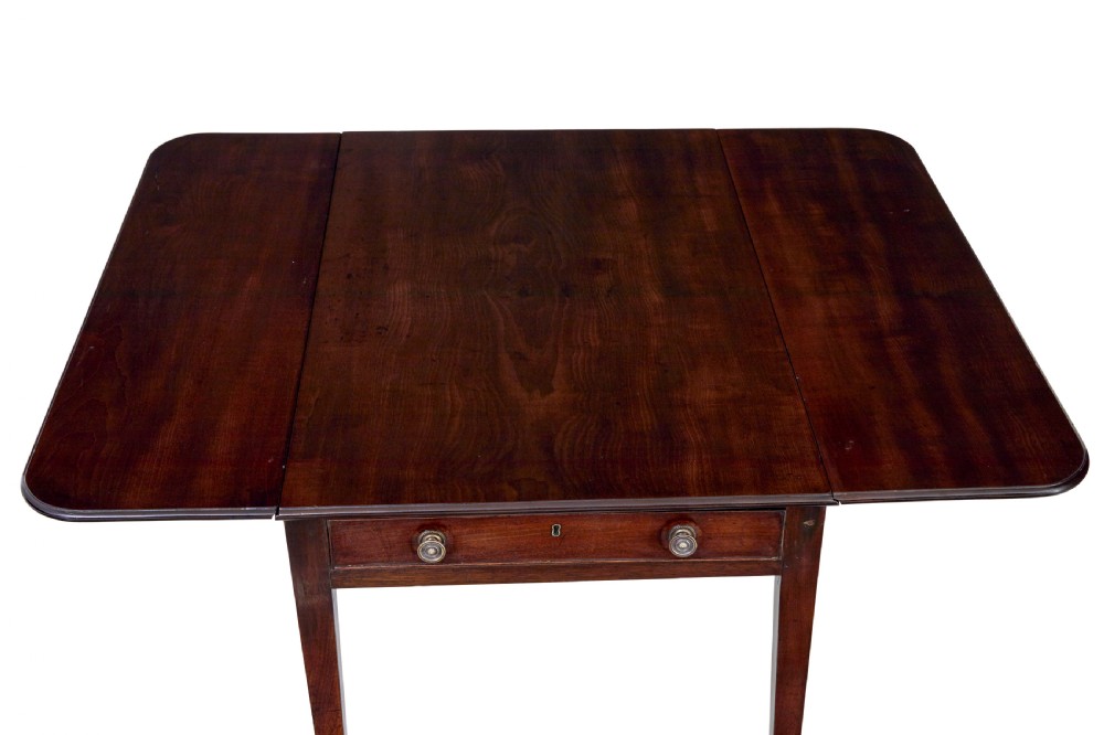 An early 19th-century mahogany Pembroke table featuring two drop-leaf flaps, a single end drawer with circular brass pull handles, and square tapered legs. View VII