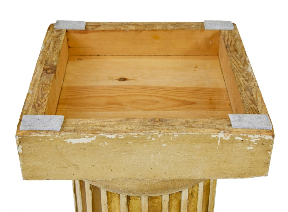 An early 20th-century Scandinavian architectural column pedestal featuring a vertical fluted design in distressed gold leaf and cream painted finish set on a square base. View VII