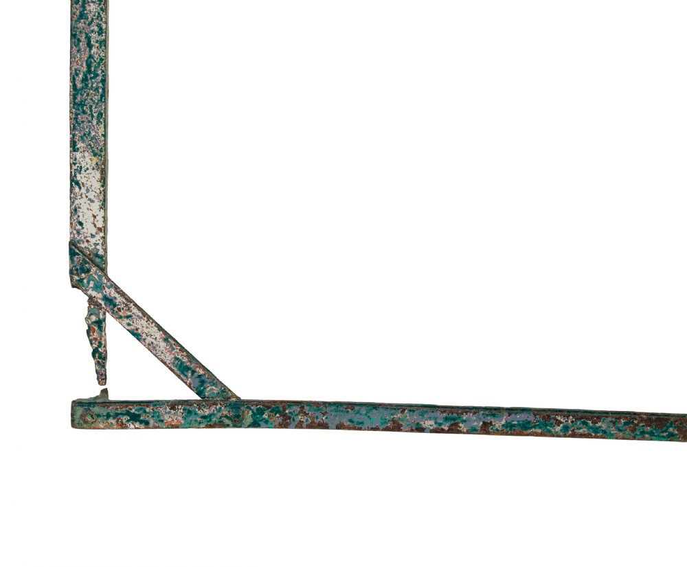 A rectangular folding metal garden table featuring a heavily distressed, multi-coloured painted surface and an X-frame iron base. View VI