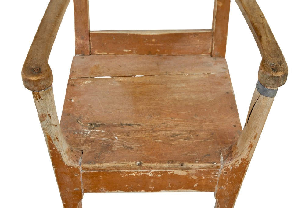 An early nineteenth-century Swedish childs armchair featuring a distressed reddish-brown painted finish over pine, straight legs, and flat armrests. View II