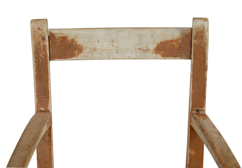 An early nineteenth-century Swedish childs armchair featuring a distressed reddish-brown painted finish over pine, straight legs, and flat armrests. View III