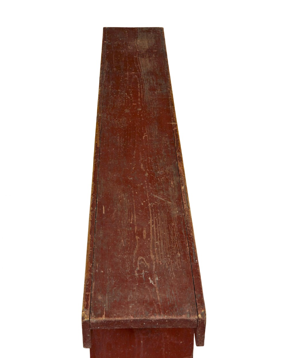 A long 19th-century Swedish pine bench painted in a distressed red finish with slab trestle legs featuring arched cut-outs. View VI