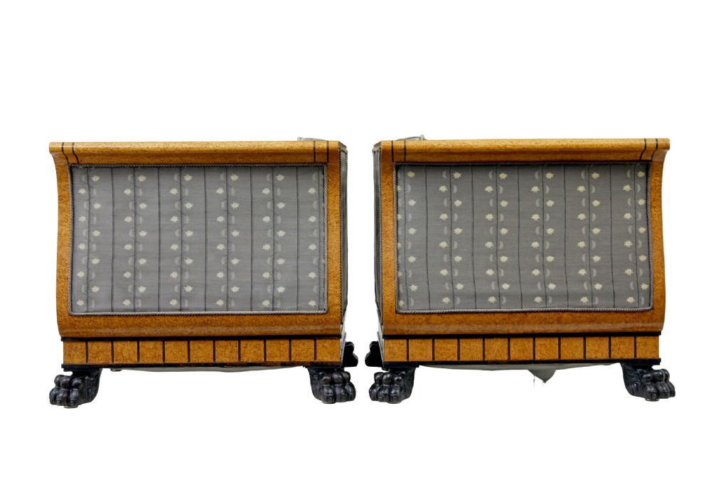 A pair of Art Deco armchairs featuring flared burr birch frames, grey upholstered cushions with a pattern motif, and ebonised carved feet. View II