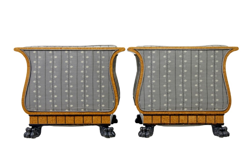 A pair of Art Deco armchairs featuring flared burr birch frames, grey upholstered cushions with a pattern motif, and ebonised carved feet. View III