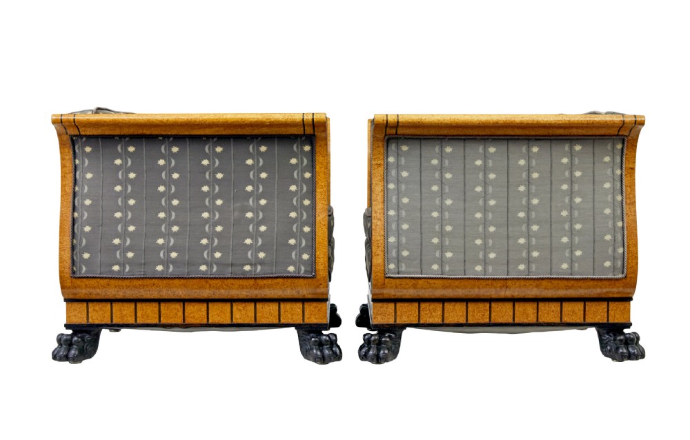 A pair of Art Deco armchairs featuring flared burr birch frames, grey upholstered cushions with a pattern motif, and ebonised carved feet. View IV