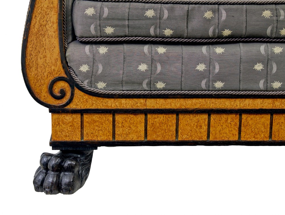 A pair of Art Deco armchairs featuring flared burr birch frames, grey upholstered cushions with a pattern motif, and ebonised carved feet. View V