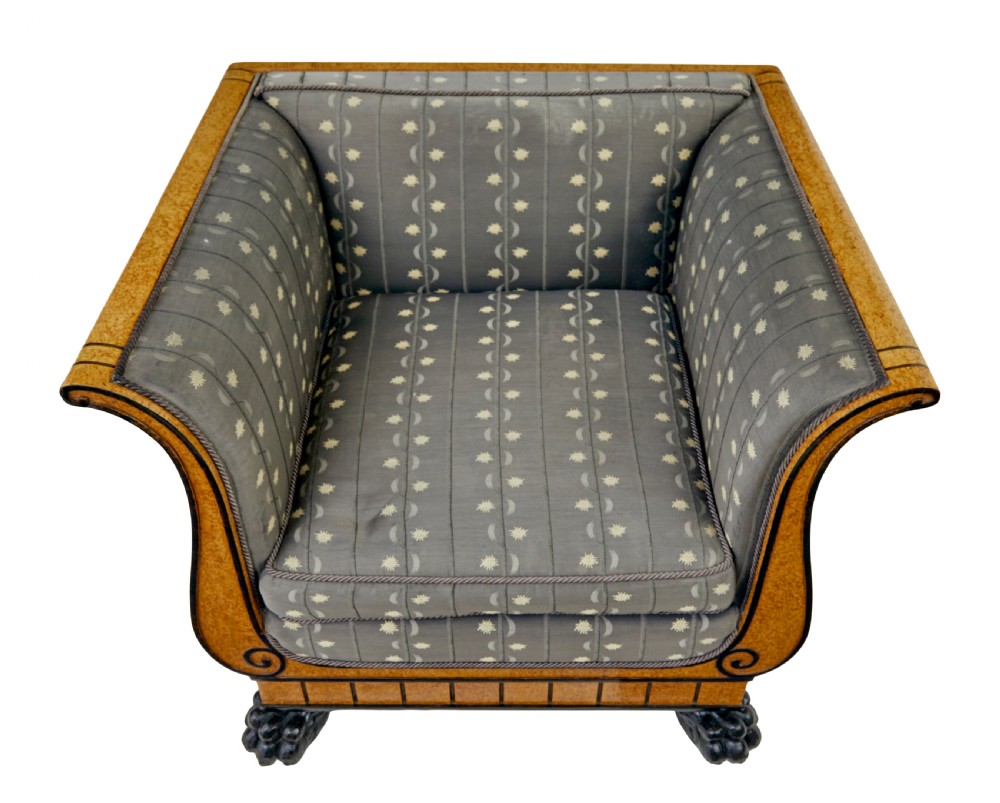 A pair of Art Deco armchairs featuring flared burr birch frames, grey upholstered cushions with a pattern motif, and ebonised carved feet. View IX