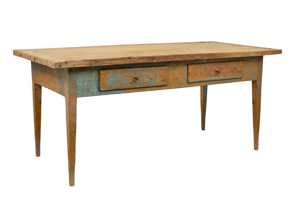 A mid 19th-century Swedish pine bakers table featuring two drawers, tapered square legs, and a distressed blue painted finish with a scrubbed wooden top.