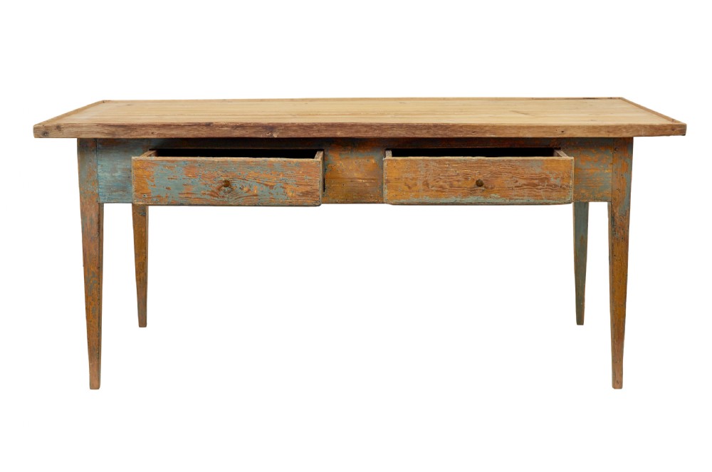 A mid 19th-century Swedish pine bakers table featuring two drawers, tapered square legs, and a distressed blue painted finish with a scrubbed wooden top. View III