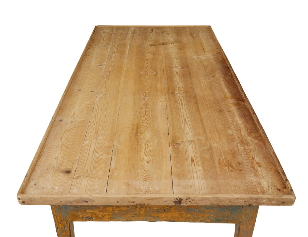 A mid 19th-century Swedish pine bakers table featuring two drawers, tapered square legs, and a distressed blue painted finish with a scrubbed wooden top. View VII